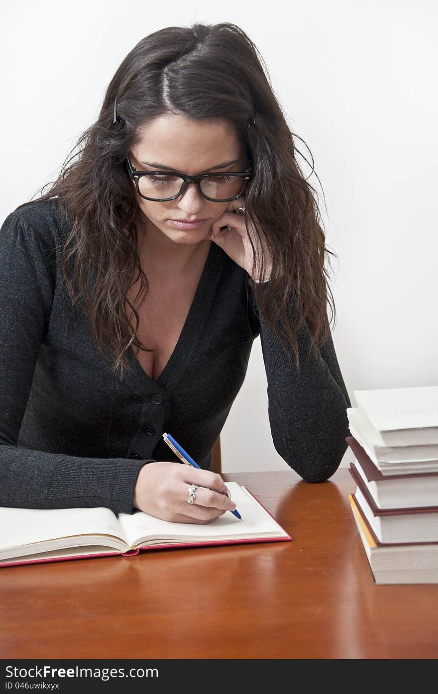 Student girl learning photographed with books, white background