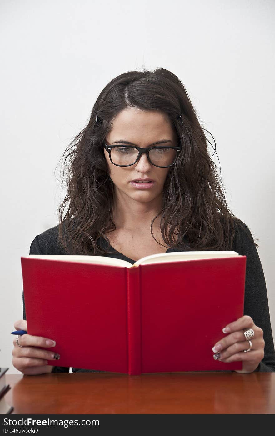 Student girl learning photographed with books, white background