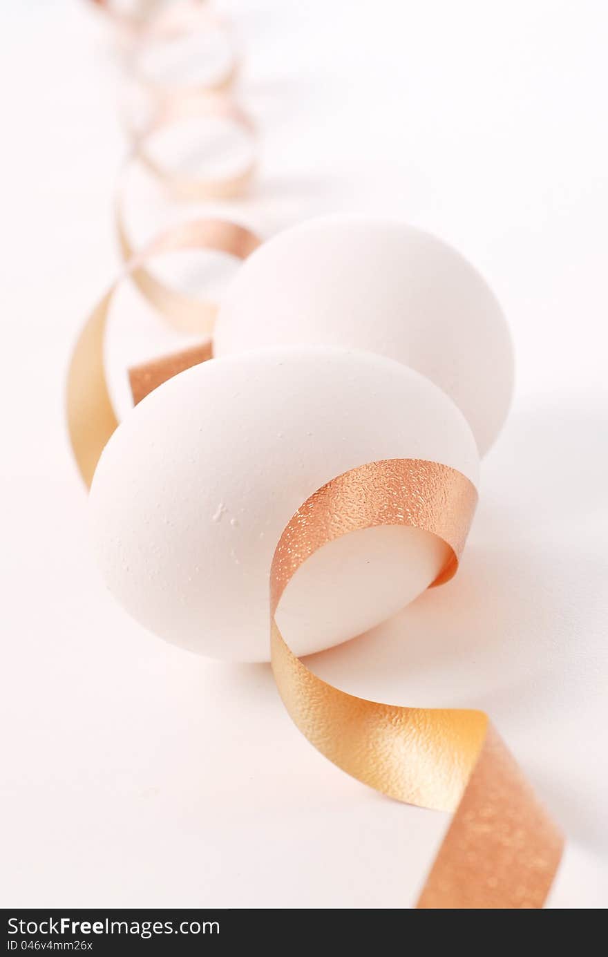 Two Eggs And A Golden Ribbon. Two Eggs And A Golden Ribbon