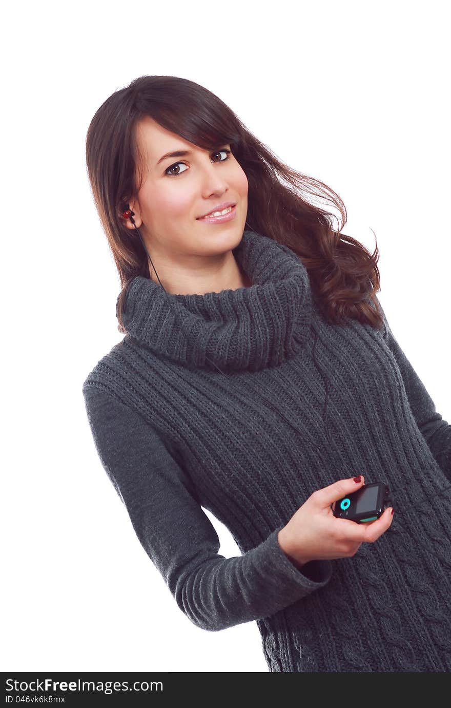 Smiling young girl with mp3 reader , listening music , On white . Smiling young girl with mp3 reader , listening music , On white .