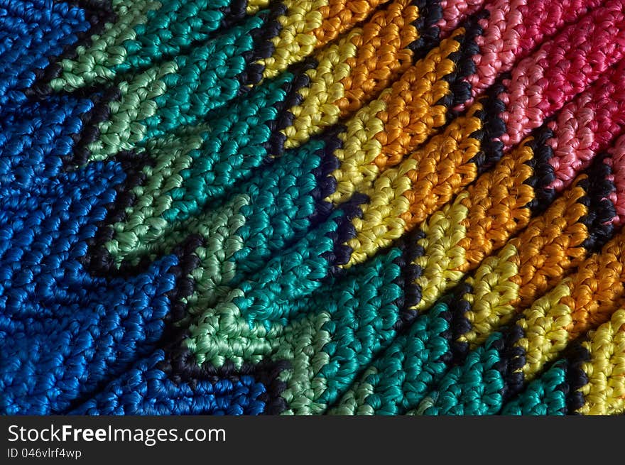 Detail of colorful knitted blankets pillows. Detail of colorful knitted blankets pillows