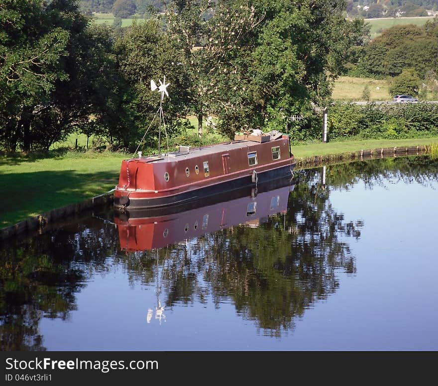 Red Narrowboat moored at Tewitfield