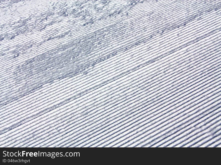 Grooves of artificial aligned snow on the ski slope. Grooves of artificial aligned snow on the ski slope