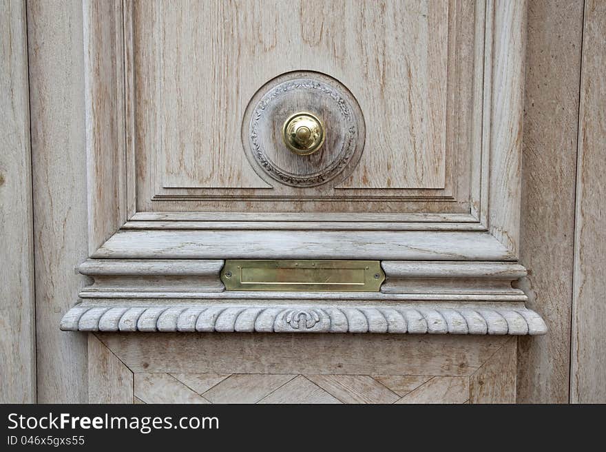 A classic mail box behind the door. A classic mail box behind the door.