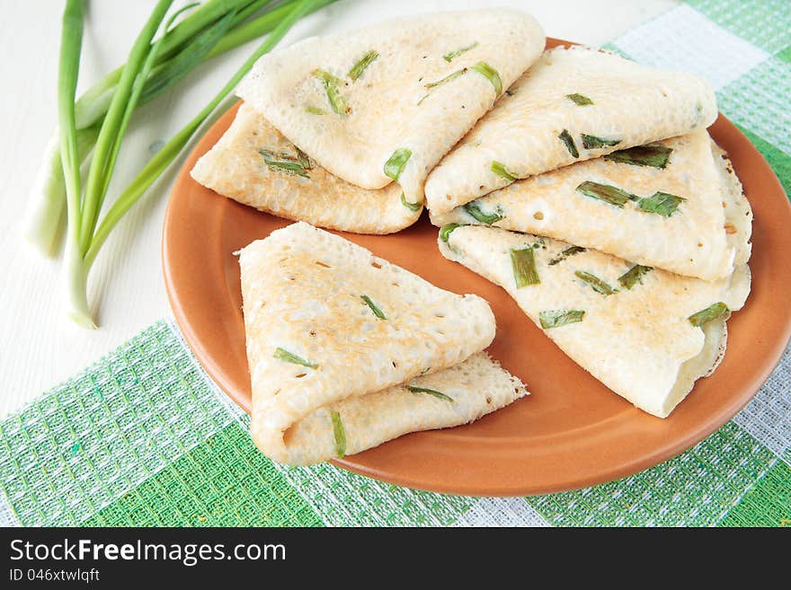 Pancakes, fried with sliced green onions