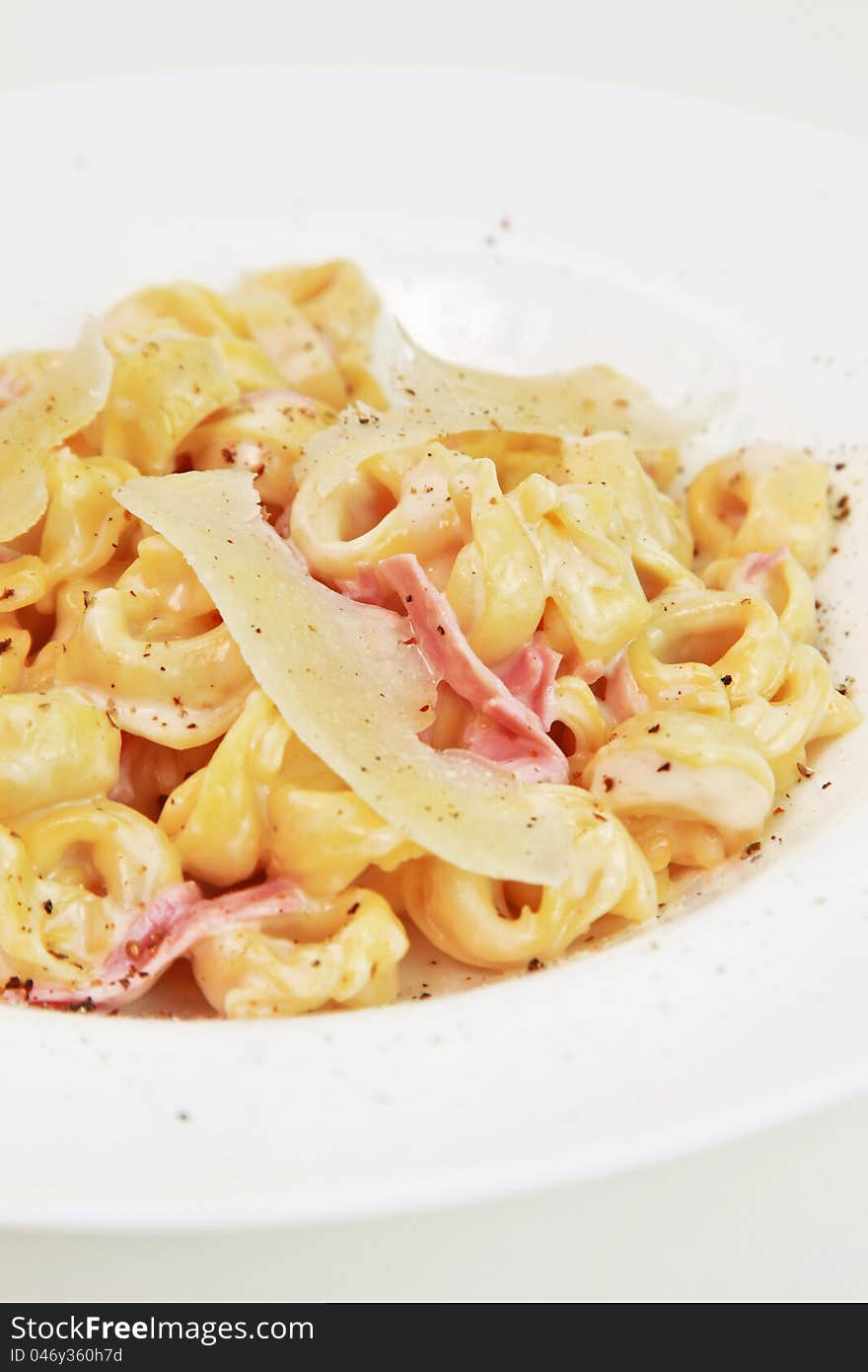 Plate of tortellini pasta with parmesan