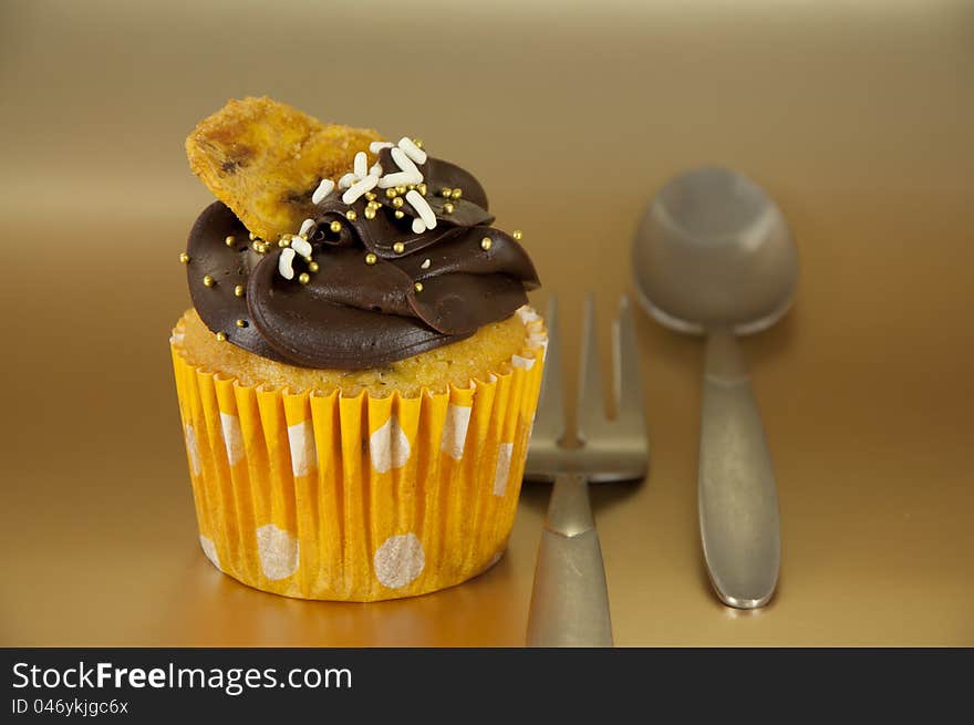 Nice Cupcake over gold background