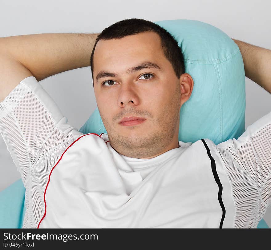 Man resting after exercises in gym