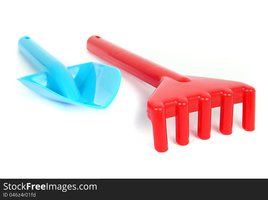 Garden toy tools on white background