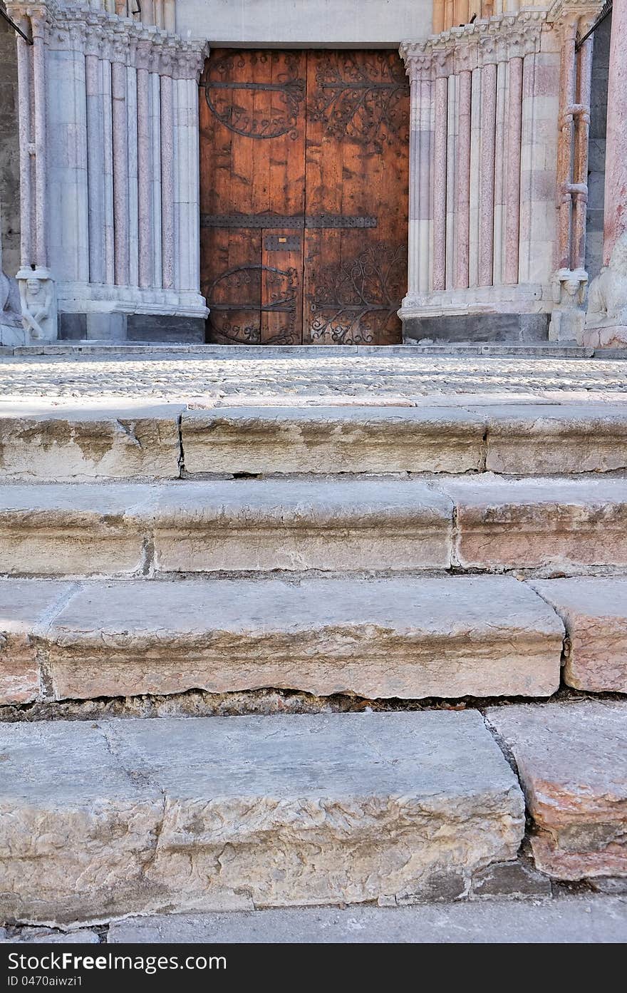 Steps of marble stairs to the door of a cathedral