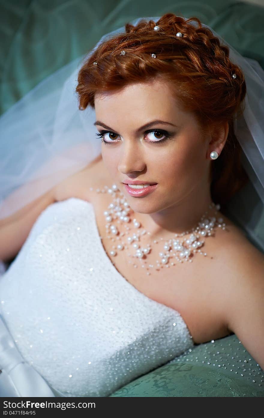 Portrait Beautiful Bride Lying On Bed