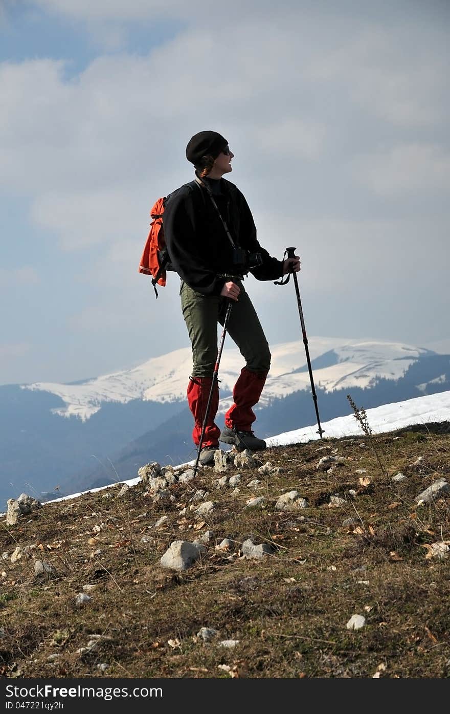 Girl photographer hiking in the mountains. Girl photographer hiking in the mountains