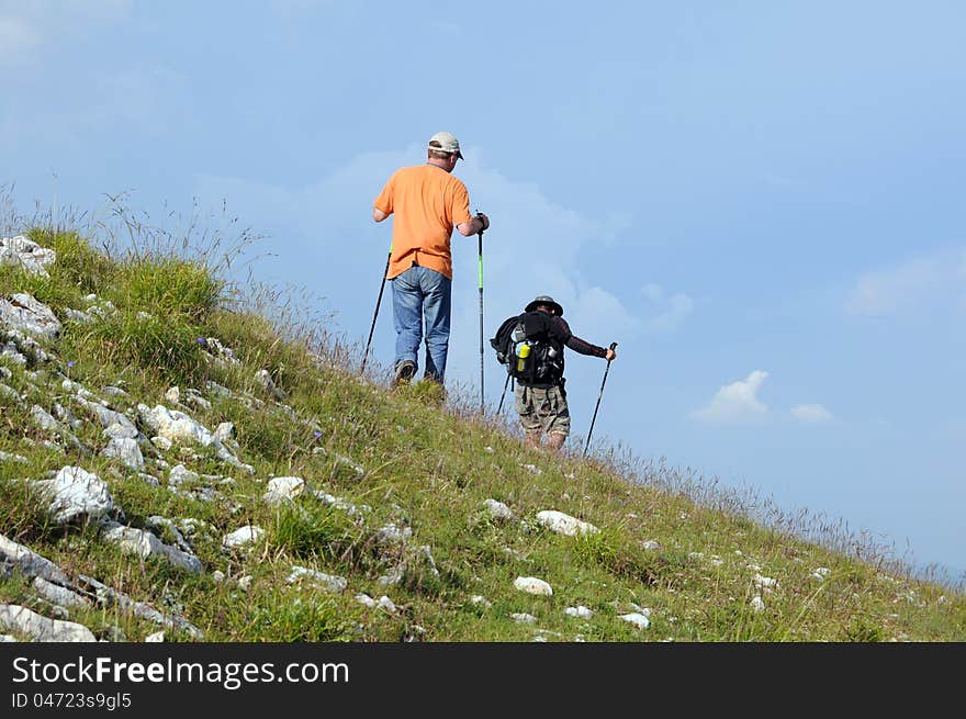 Hikers with backpacks in the mountains