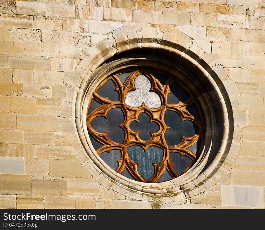 Circular window from a church built with stones