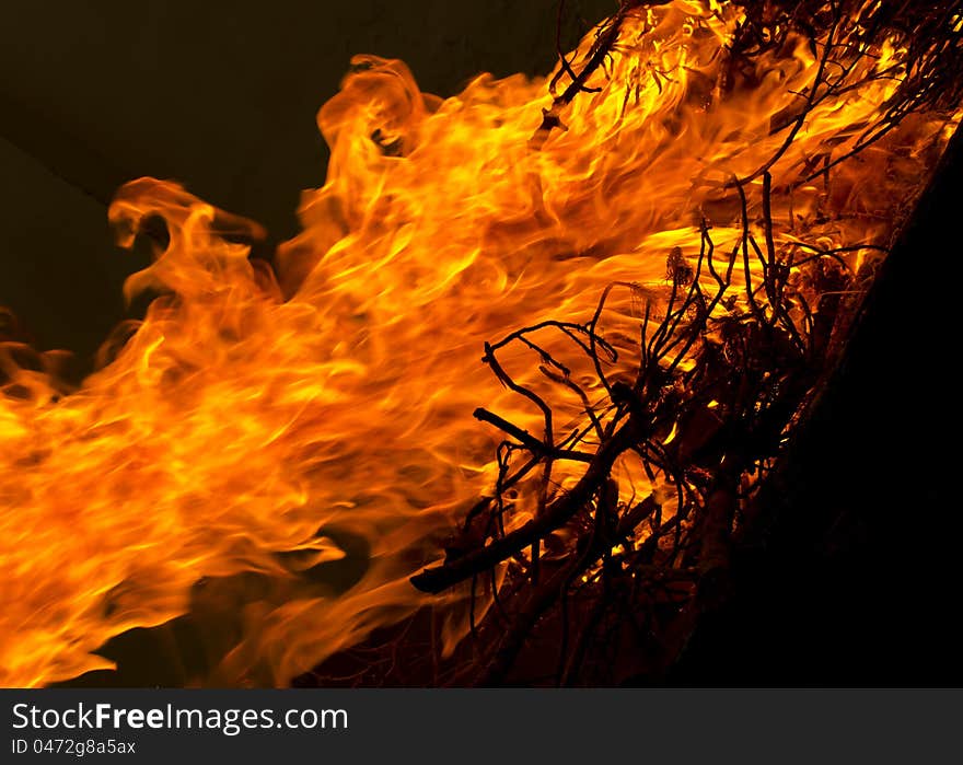 Fire with black background and wood burning. Fire with black background and wood burning