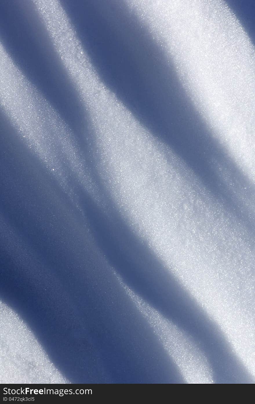 Background created by the undulations of a snow surface