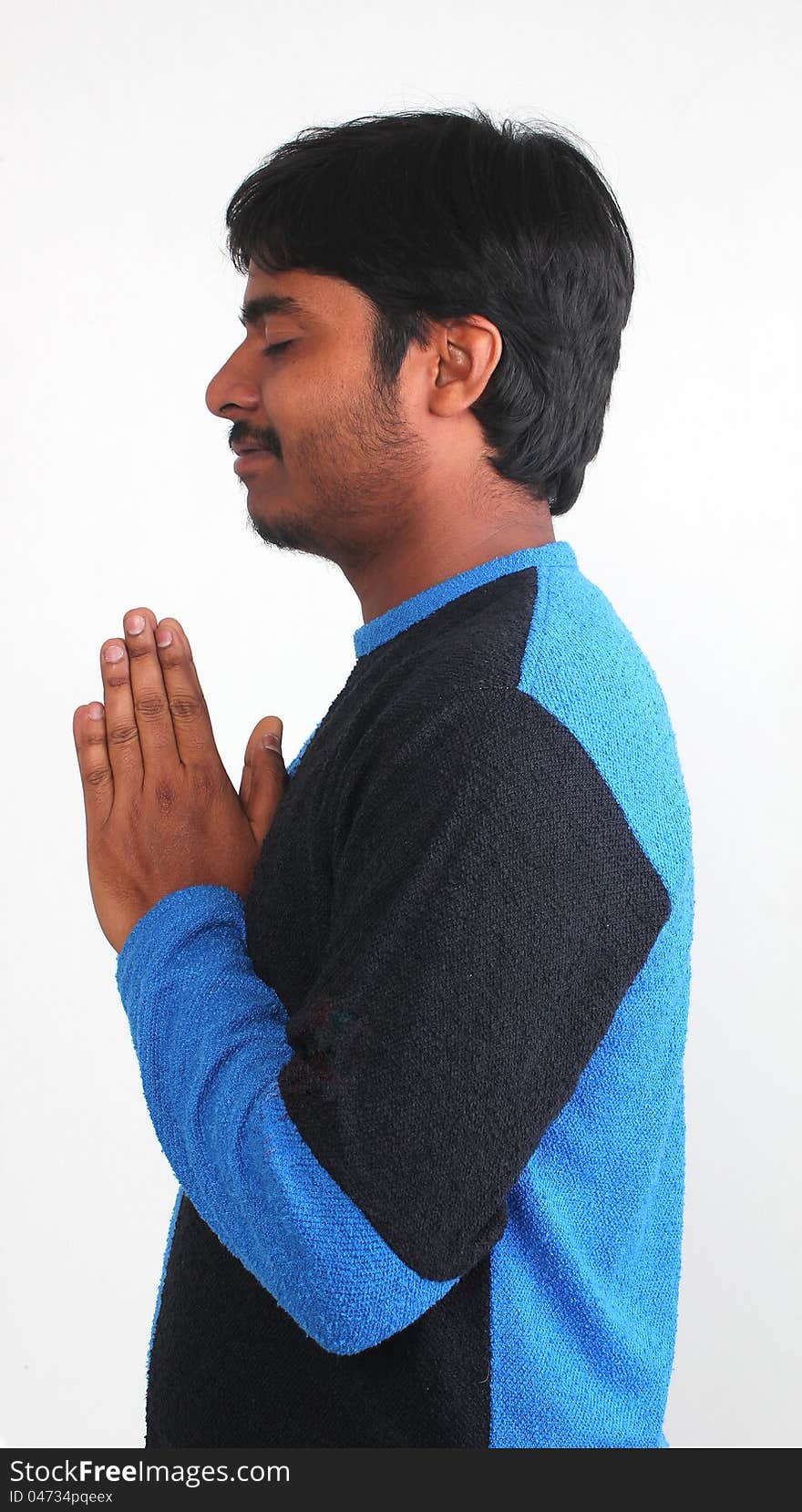 Photo of handsome youth praying with white background. Photo of handsome youth praying with white background