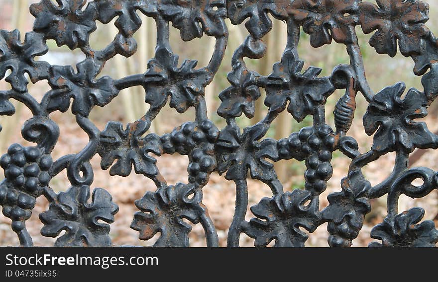 Antique wrought iron bench found in a park in Memphis, Tennessee. Antique wrought iron bench found in a park in Memphis, Tennessee