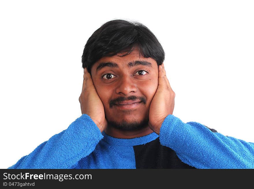 Indian male showing distress by covering his ears with hand with expressive face