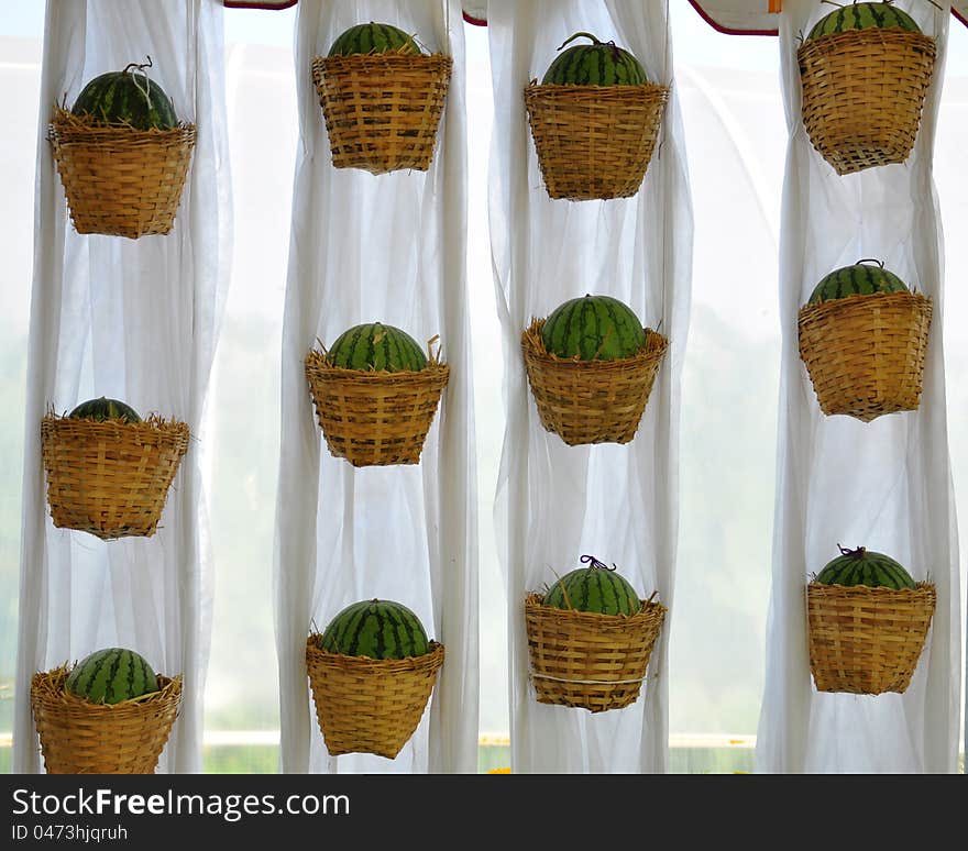 Watermelon basket on a white cloth