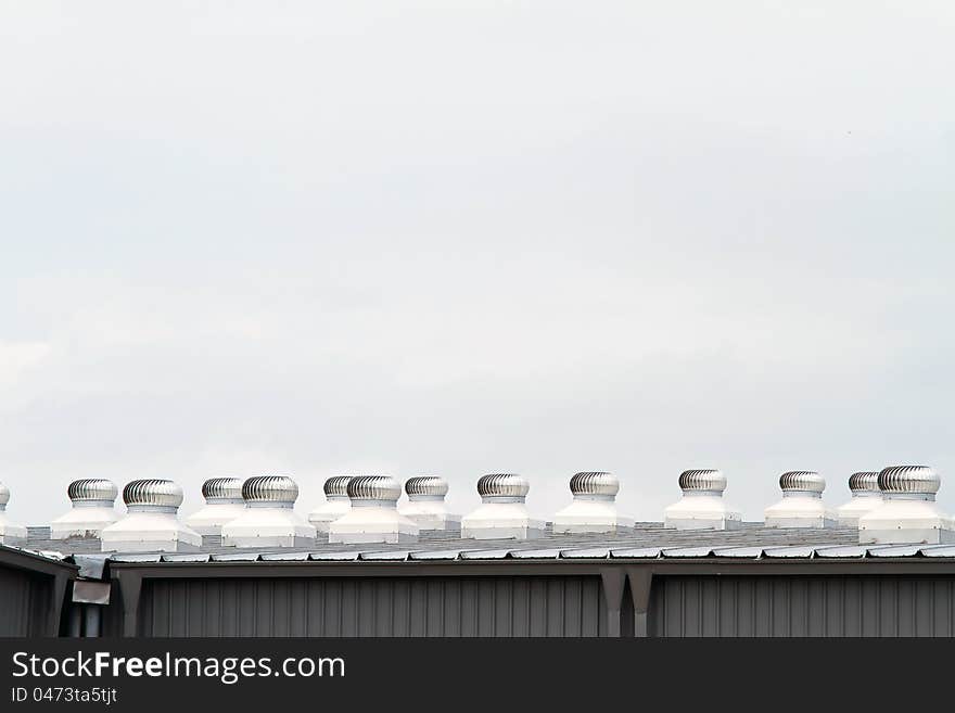 Industrial factory roof with a lot of ventilator for better air ventilation. Industrial factory roof with a lot of ventilator for better air ventilation