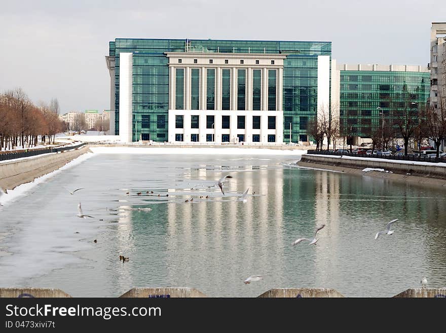 Modern building on a river bank