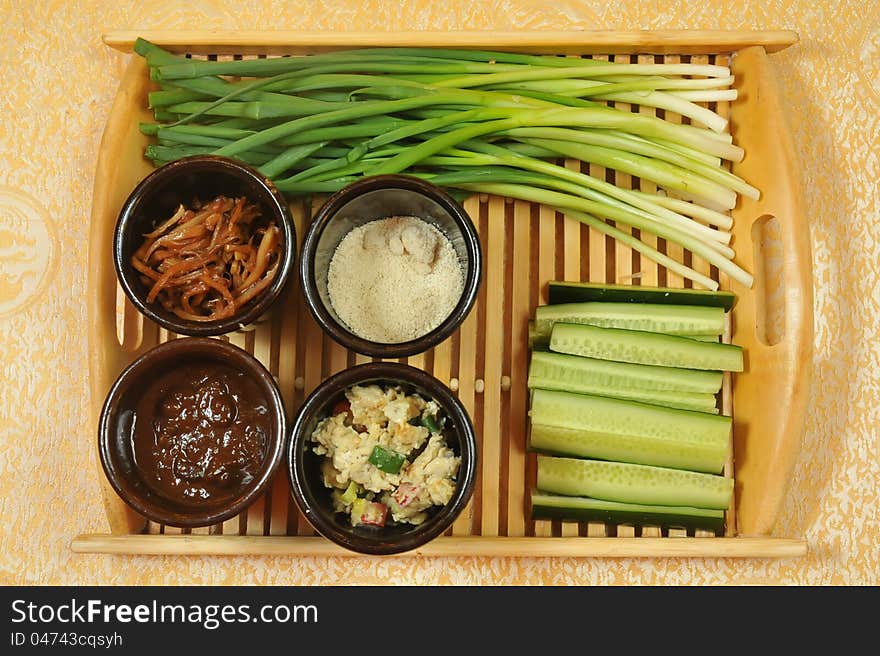 Chinese appetizers .  green onions and cucumbers