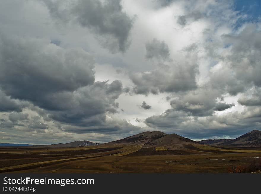 Hill landscape with dramatic sky