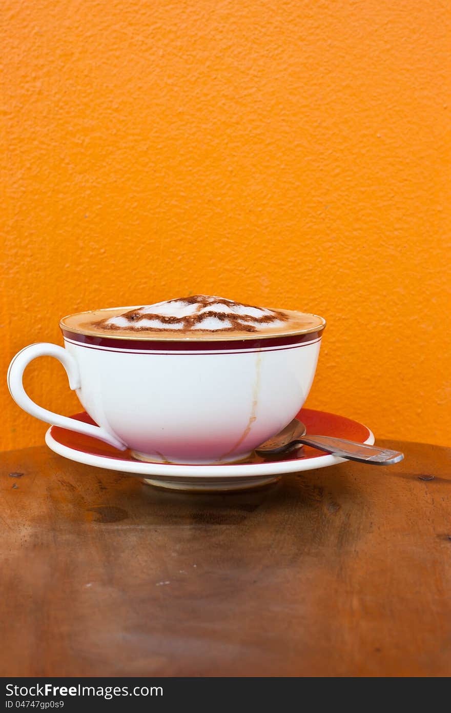 Cappuccino in white cup on table