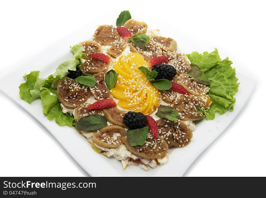 Salad with figs on a plate on a white background