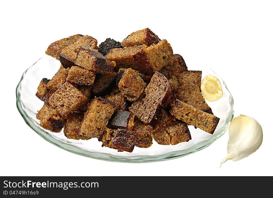 Bread rusks with garlic on plate isolated on a white background