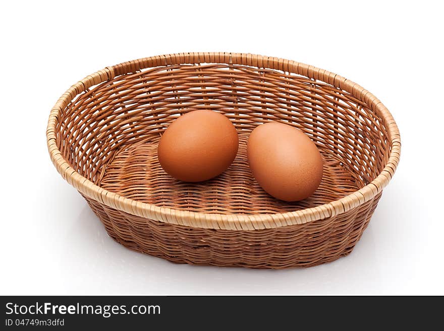 Two eggs in wicker basket