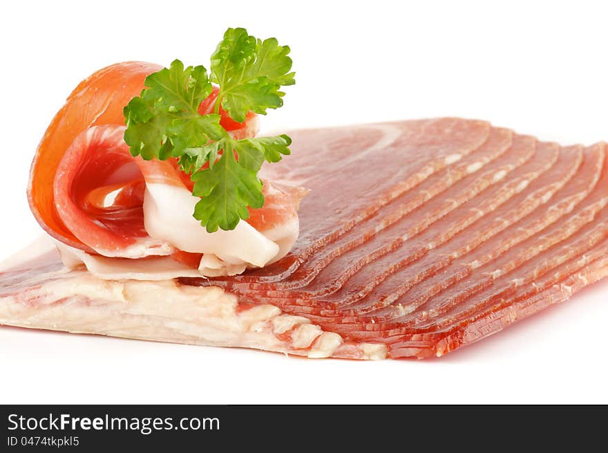 Thin slices of jamon on white background