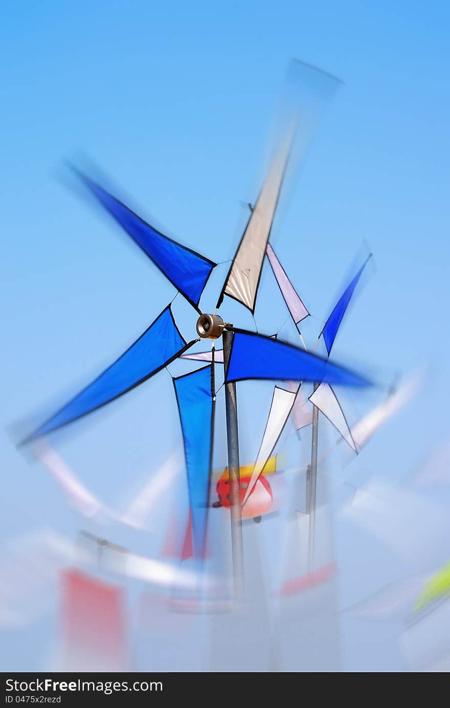 Pinwheel turning fast under blue sky