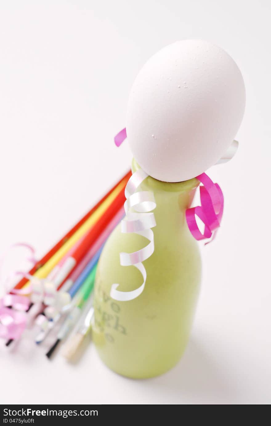 Painting Eggs for Easter With Ribbons And Paintbrushes. Painting Eggs for Easter With Ribbons And Paintbrushes