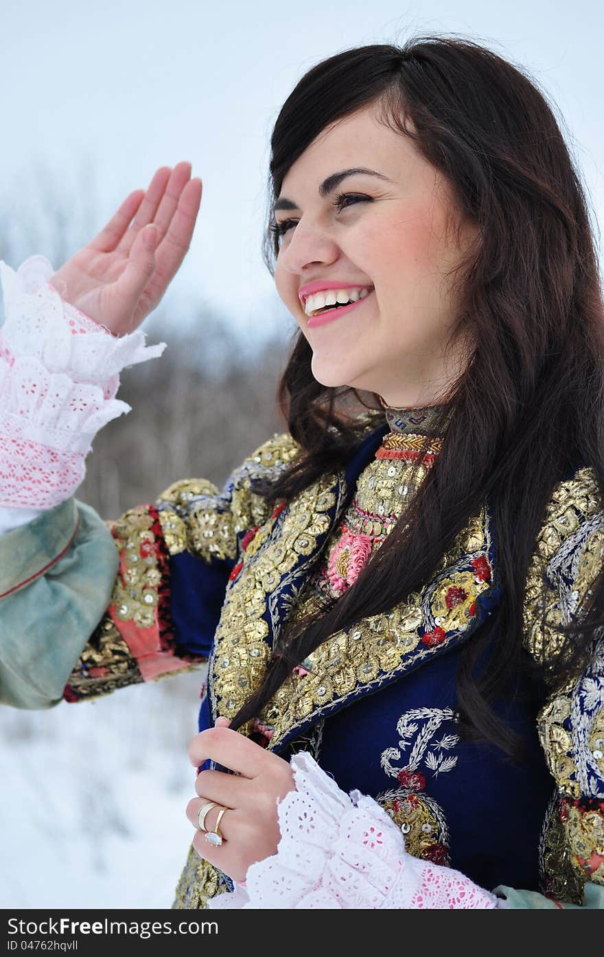 The portrait of a woman dressed in traditional Bulgarian costume.