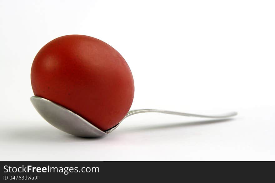 Red egg on the spoon. Red egg on the spoon