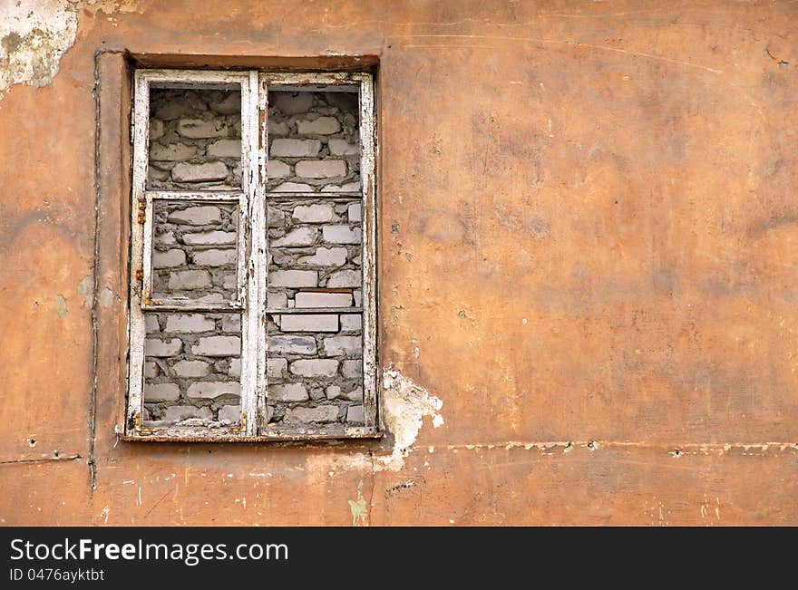 Grunge window without glass on abandoned building