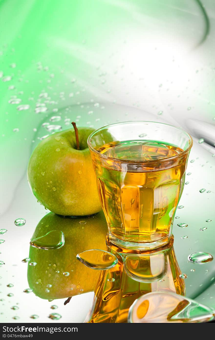 Ripe apple and juice on abstract background. Ripe apple and juice on abstract background