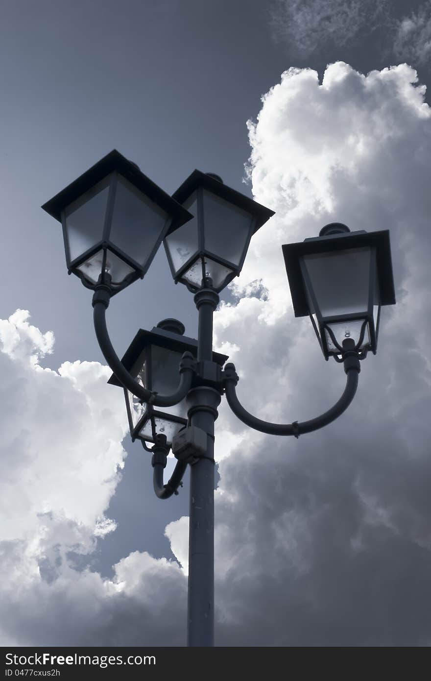 Lamp against clouds can be used as a background