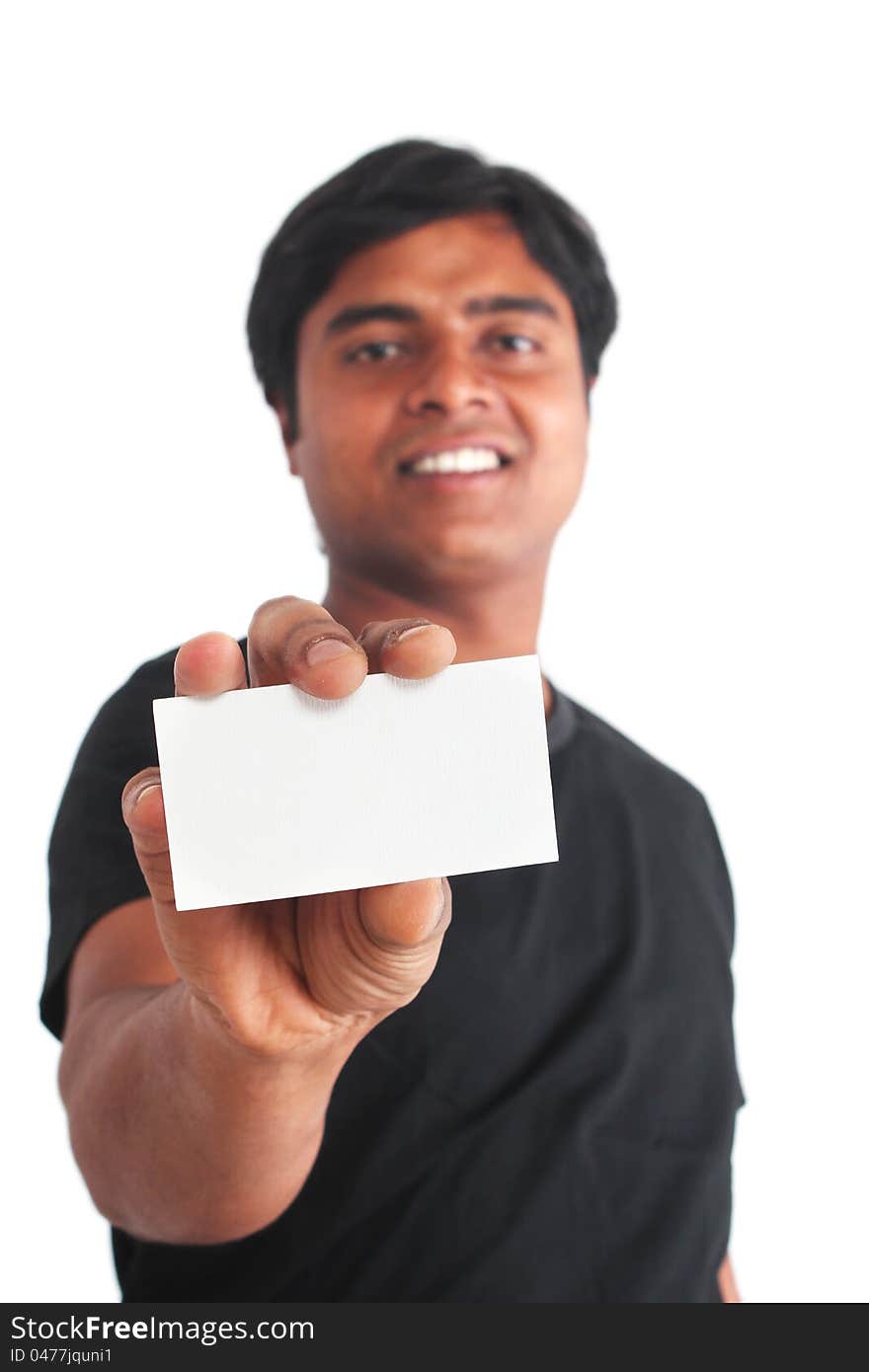 Young indian guy on isolated white background holding business card. Young indian guy on isolated white background holding business card