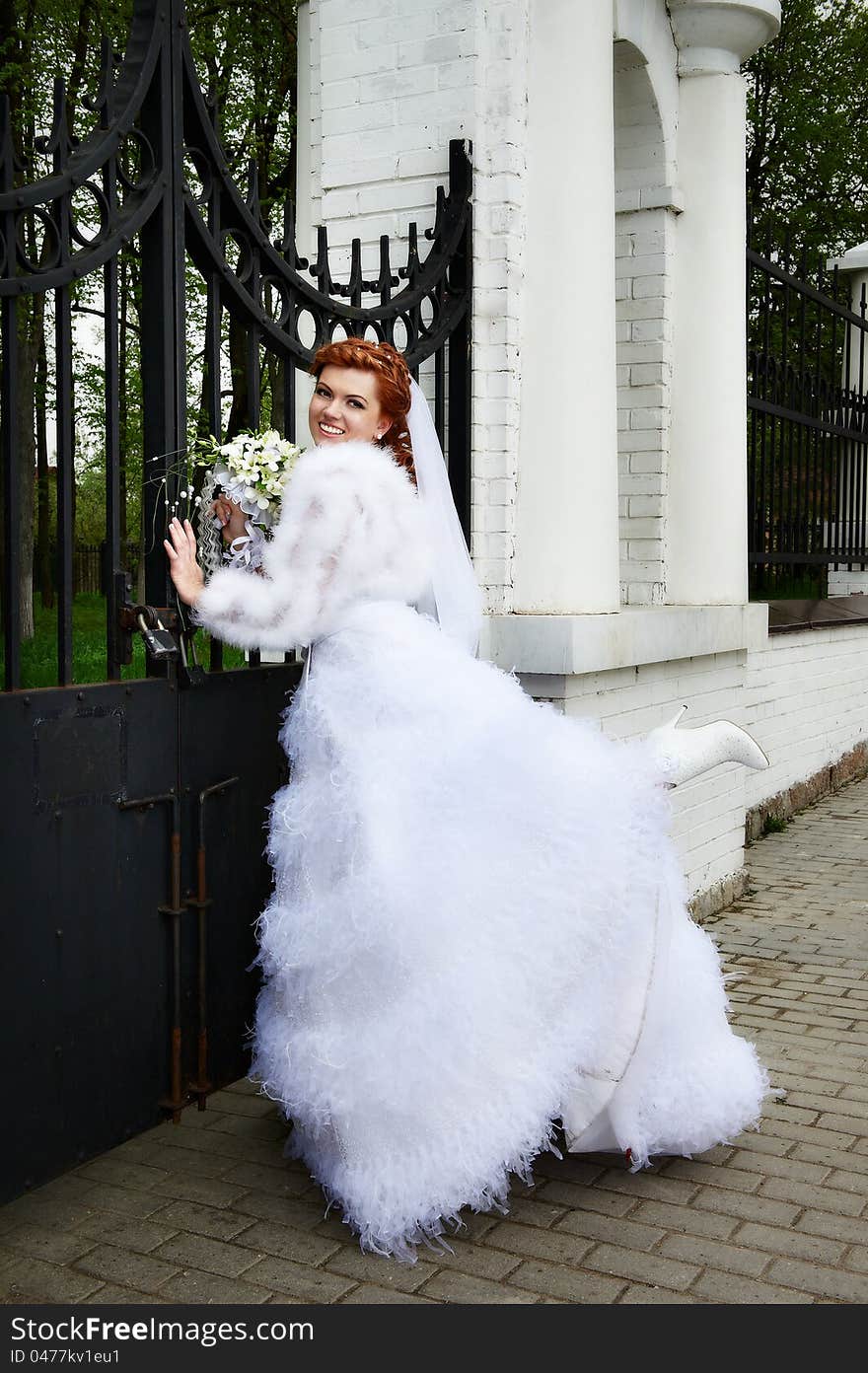 Happy bride in park at wedding walk