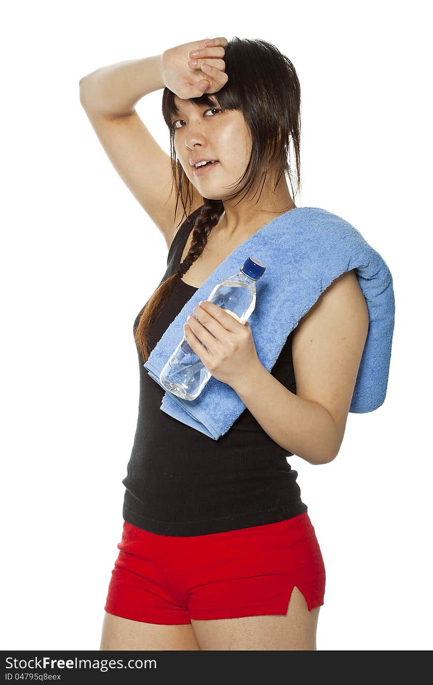 Asian girl with towel and bottle of water isolated on white. Closeup, vertical composition