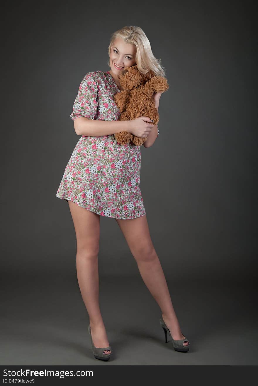 Beautiful Blonde Woman With Teddy Bear