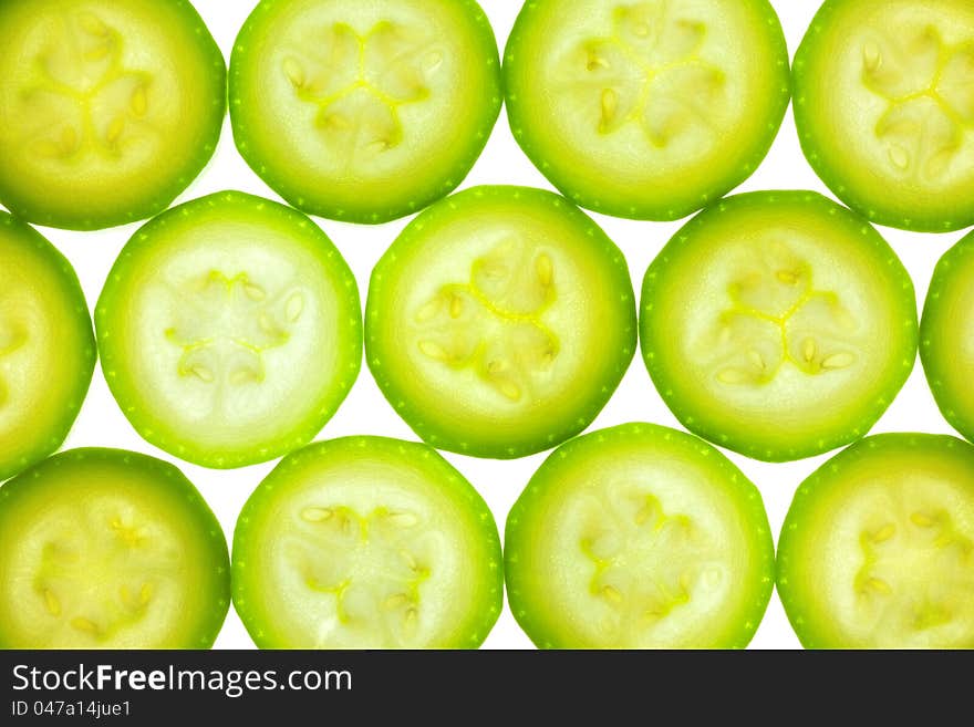 Slices Of Zucchini Or Courgette Isolated On White