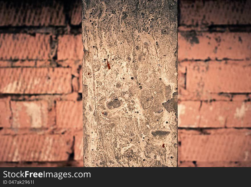 Old cement column at brick wall. Old cement column at brick wall