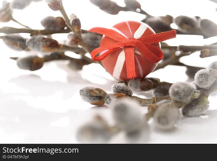 Red Easter Egg With a Bunch of Catkins on white background. Red Easter Egg With a Bunch of Catkins on white background