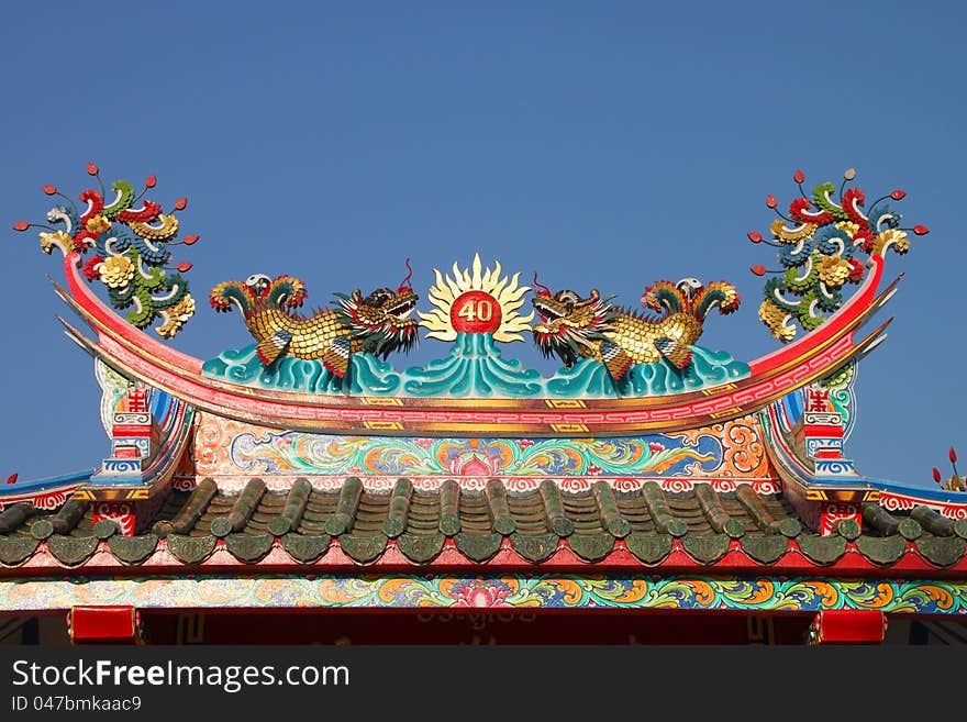 Golden dragons on roof of Chinese shrine. Golden dragons on roof of Chinese shrine