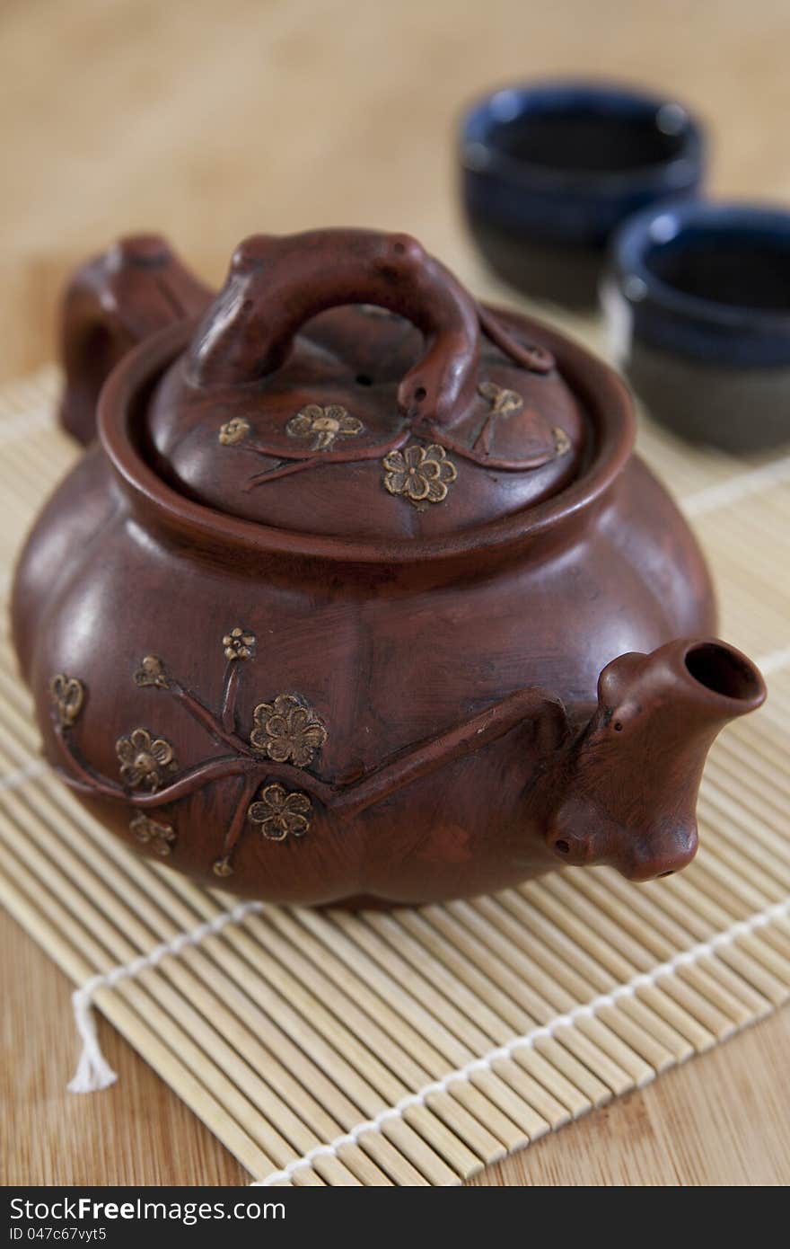 Rustic, brown Asian ceramic teapott. Rustic, brown Asian ceramic teapott