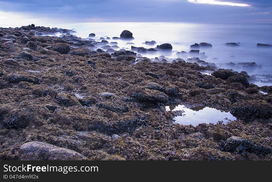 Rocky shore line in the early morning